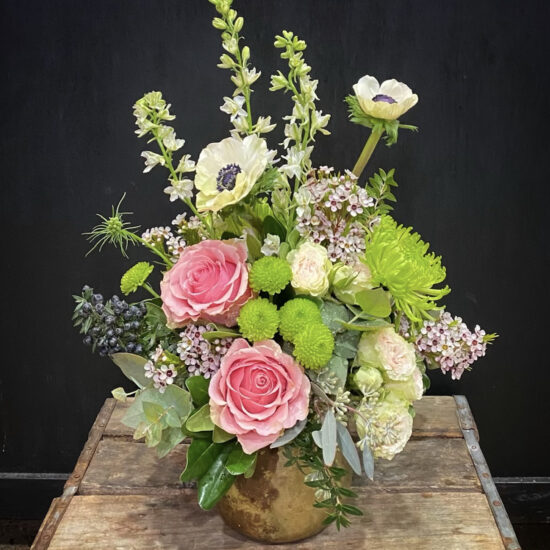 pink and green and white floral arrangement by subscription